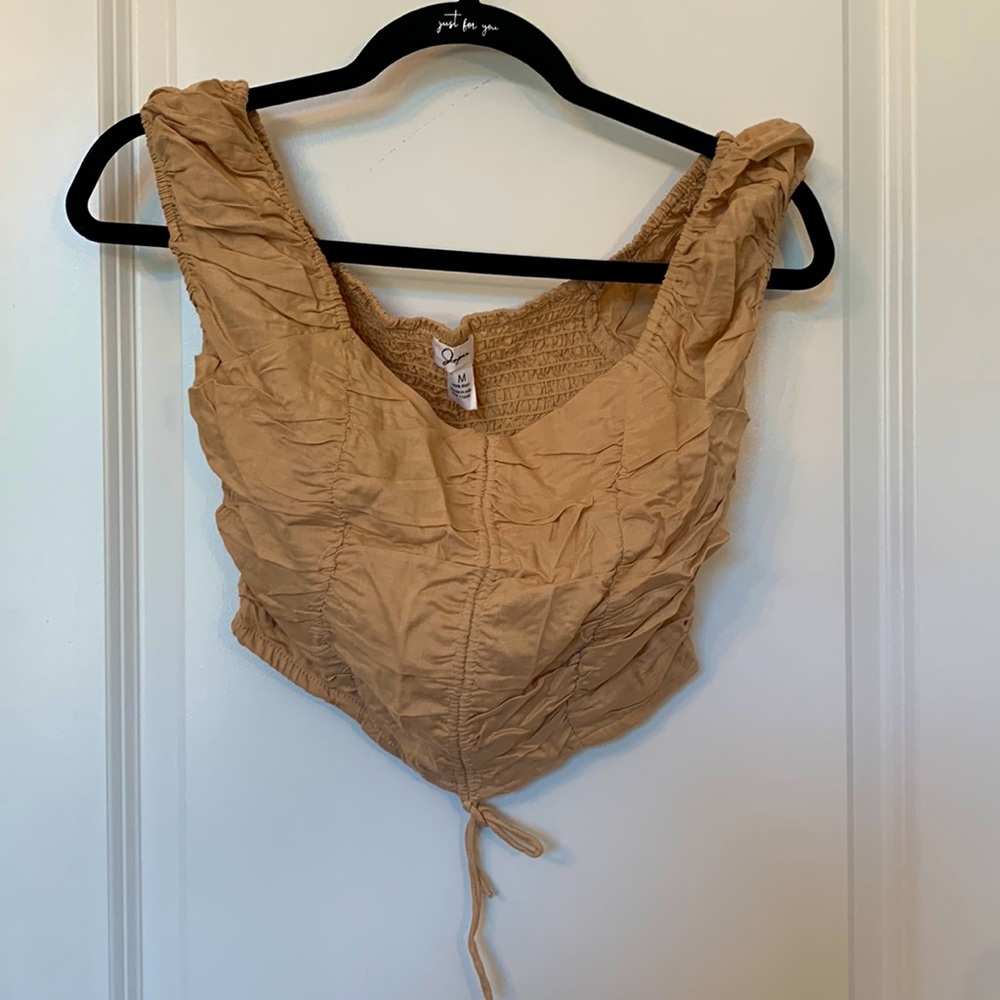 Tight nude crop top, fits like a small